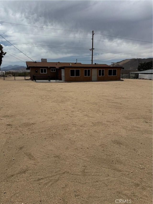 7395 Sage Ave, Yucca Valley, CA 92284 - rear view of house featuring a mountain view