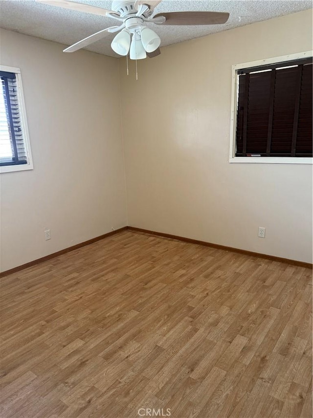 7395 Sage Ave, Yucca Valley, CA 92284 - spare room featuring light wood-type flooring, ceiling fan, and a textured ceiling