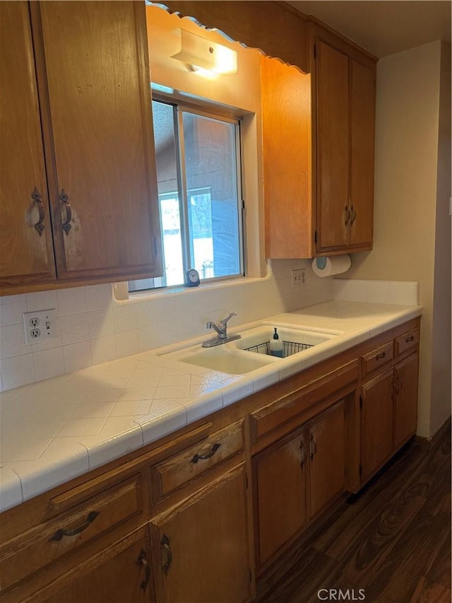 7395 Sage Ave, Yucca Valley, CA 92284 - kitchen featuring dark wood-type flooring, tasteful backsplash, and light countertops