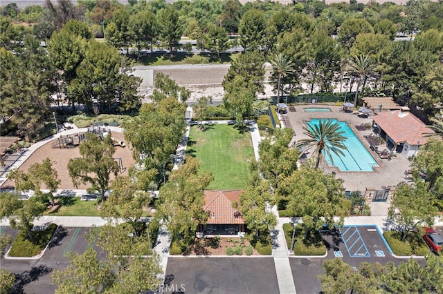 811 Larkridge, Irvine, CA 92618 - aerial view of property and surrounding area with a pool and a tree filled landscape