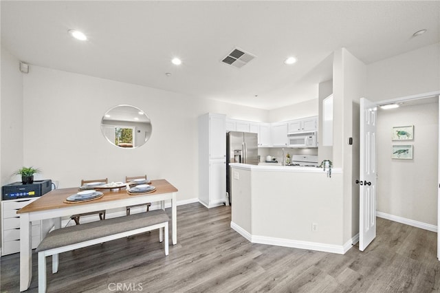 811 Larkridge, Irvine, CA 92618 - kitchen featuring white appliances, light wood finished floors, white cabinets, recessed lighting, and light countertops