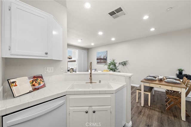811 Larkridge, Irvine, CA 92618 - kitchen with white dishwasher, tile countertops, dark wood finished floors, a peninsula, and white cabinets