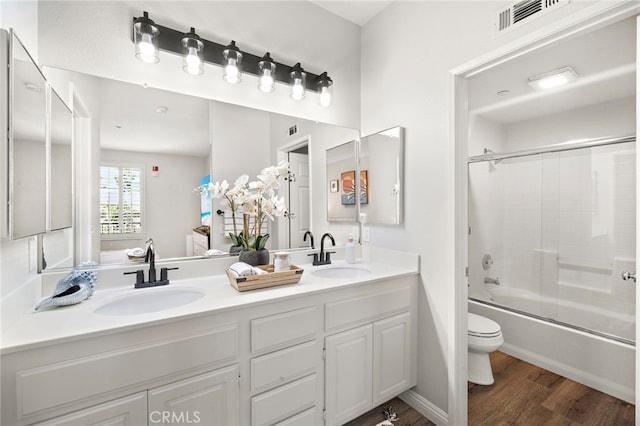 811 Larkridge, Irvine, CA 92618 - bathroom featuring double vanity, wood finished floors, and bath / shower combo with glass door