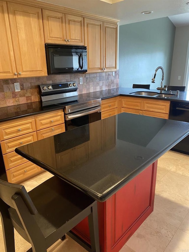 5983 Gaines St, San Diego, CA 92110 - kitchen featuring black appliances, backsplash, dark countertops, and a kitchen island