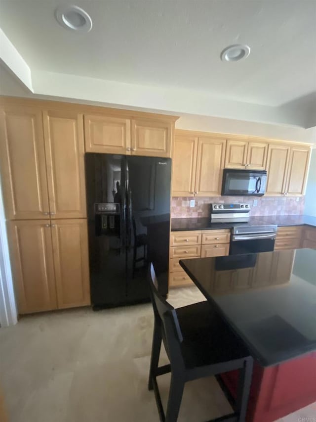 5983 Gaines St, San Diego, CA 92110 - kitchen featuring black appliances, light brown cabinets, backsplash, and dark countertops
