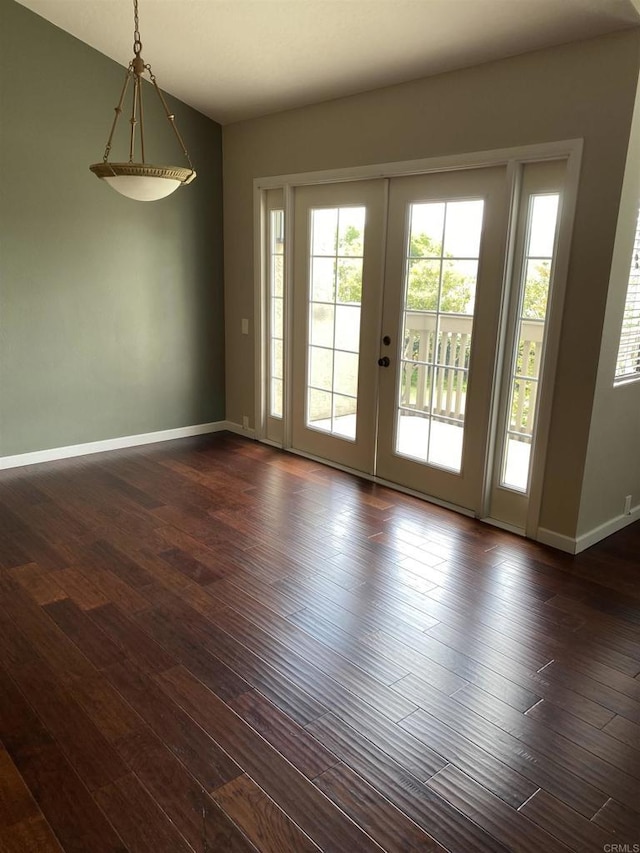 5983 Gaines St, San Diego, CA 92110 - empty room with french doors and dark wood finished floors