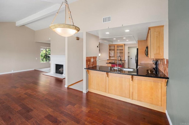 5983 Gaines St, San Diego, CA 92110 - kitchen featuring light brown cabinets, open floor plan, dark wood-style floors, and freestanding refrigerator