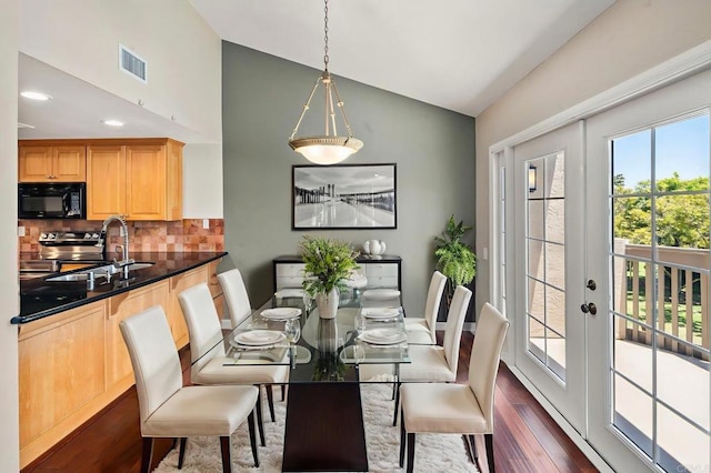 5983 Gaines St, San Diego, CA 92110 - dining space with lofted ceiling, dark wood-type flooring, and french doors