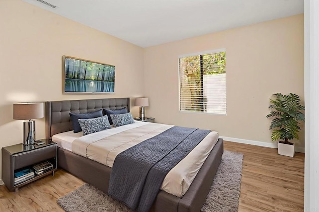 5983 Gaines St, San Diego, CA 92110 - bedroom featuring wood finished floors and baseboards