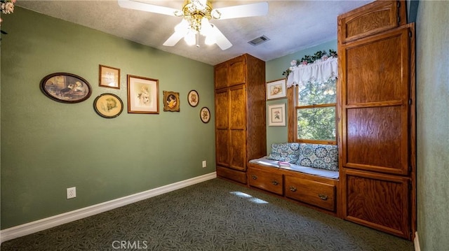 24083 Cresta Dr, Crestline, CA 92325 - unfurnished bedroom featuring dark colored carpet and ceiling fan