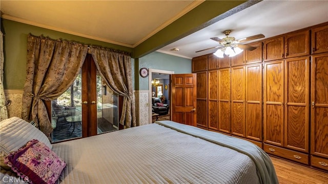 24083 Cresta Dr, Crestline, CA 92325 - bedroom with ornamental molding, wood finished floors, french doors, and a ceiling fan
