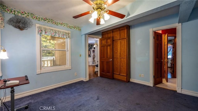 24083 Cresta Dr, Crestline, CA 92325 - unfurnished bedroom with dark colored carpet and baseboards