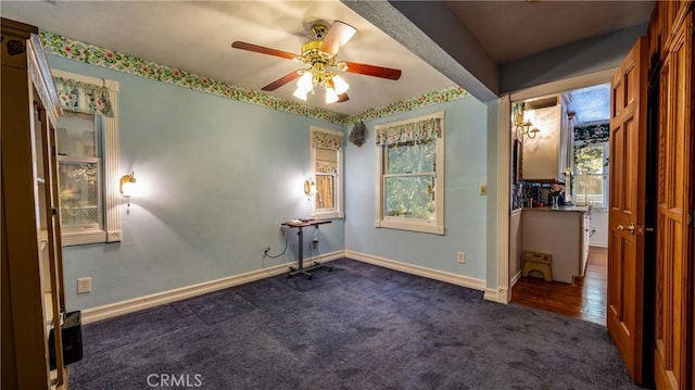 24083 Cresta Dr, Crestline, CA 92325 - carpeted empty room featuring baseboards and ceiling fan