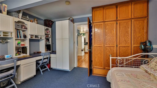 24083 Cresta Dr, Crestline, CA 92325 - bedroom featuring ornamental molding, dark carpet, and a desk