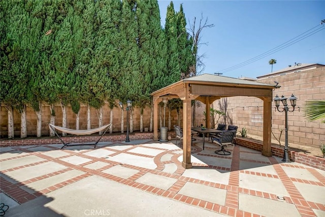 15521 Sandra Ln, Sylmar, CA 91342 - fenced backyard featuring a gazebo, a patio, and outdoor dining area