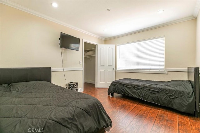 15521 Sandra Ln, Sylmar, CA 91342 - bedroom featuring wood finished floors, ornamental molding, recessed lighting, a spacious closet, and a closet