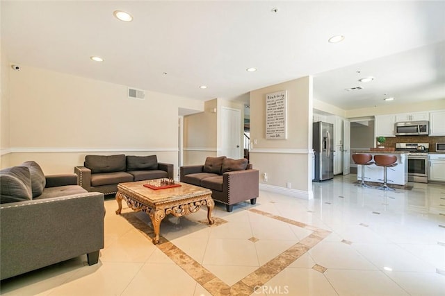 15521 Sandra Ln, Sylmar, CA 91342 - living area with recessed lighting and light tile patterned floors