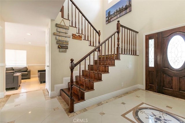 15521 Sandra Ln, Sylmar, CA 91342 - foyer with inlaid floor details, stairway, tile patterned flooring, a high ceiling, and recessed lighting