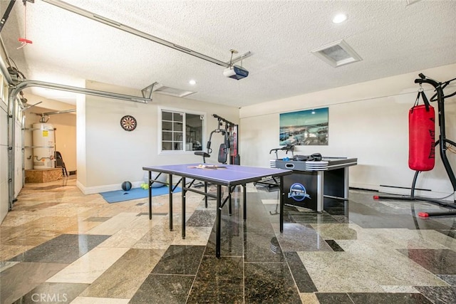 15521 Sandra Ln, Sylmar, CA 91342 - playroom with a garage, strapped water heater, a textured ceiling, and recessed lighting