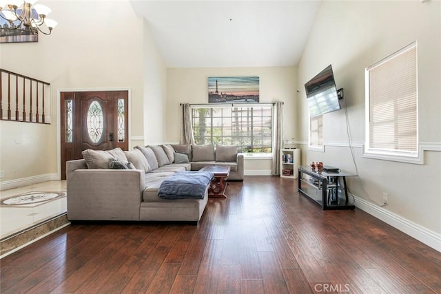 15521 Sandra Ln, Sylmar, CA 91342 - living room featuring a chandelier, high vaulted ceiling, wood-type flooring, and healthy amount of natural light