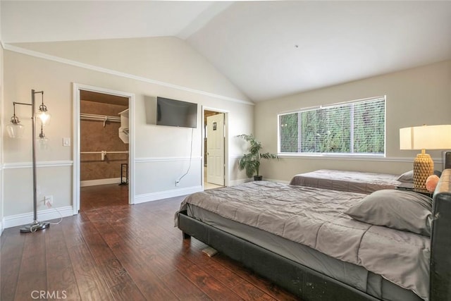 15521 Sandra Ln, Sylmar, CA 91342 - bedroom featuring a walk in closet, vaulted ceiling, wood finished floors, and a closet