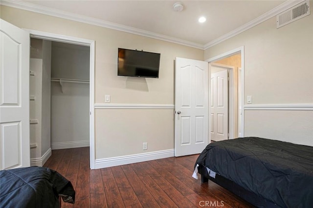 15521 Sandra Ln, Sylmar, CA 91342 - bedroom with a spacious closet, wood-type flooring, ornamental molding, and a closet