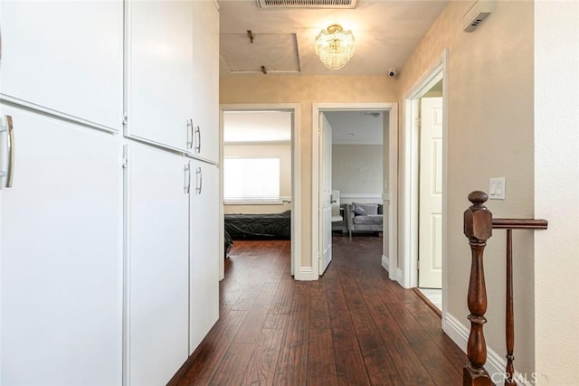 15521 Sandra Ln, Sylmar, CA 91342 - hallway featuring dark wood-type flooring and baseboards