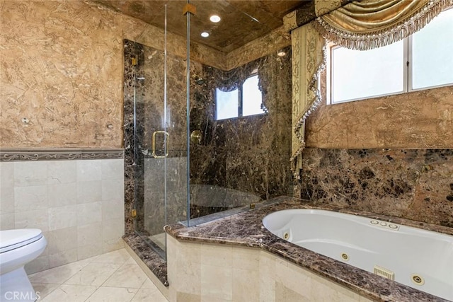 15521 Sandra Ln, Sylmar, CA 91342 - bathroom featuring tile walls, a tub with jets, and a stall shower