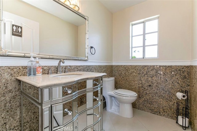 15521 Sandra Ln, Sylmar, CA 91342 - half bath with tile walls, wainscoting, tile patterned flooring, and vanity
