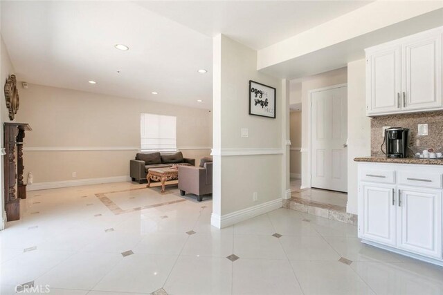 15521 Sandra Ln, Sylmar, CA 91342 - kitchen with white cabinetry, tasteful backsplash, light tile patterned floors, and recessed lighting