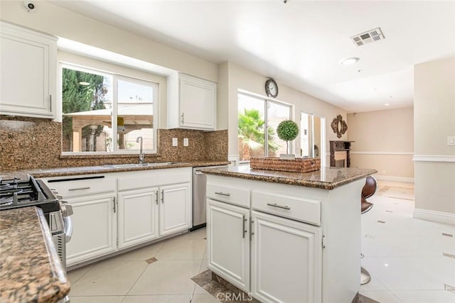 15521 Sandra Ln, Sylmar, CA 91342 - kitchen featuring appliances with stainless steel finishes, healthy amount of natural light, decorative backsplash, and recessed lighting