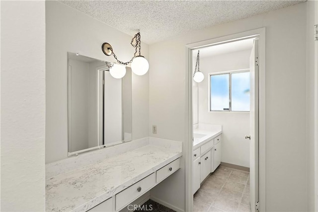 457 Brian Ct, Merced, CA 95348 - bathroom featuring vanity and a textured ceiling