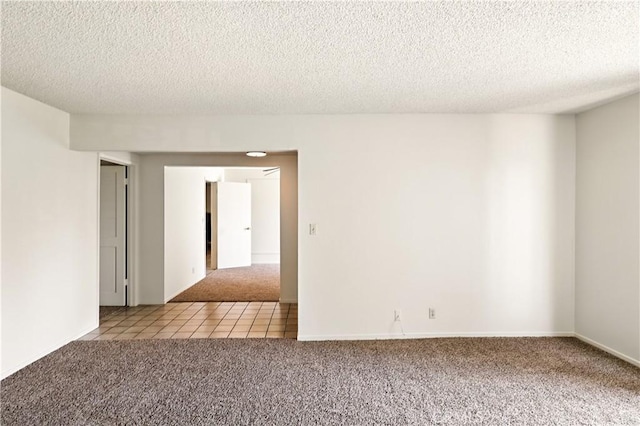 457 Brian Ct, Merced, CA 95348 - carpeted empty room with a textured ceiling and tile patterned floors