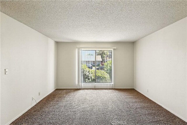 457 Brian Ct, Merced, CA 95348 - carpeted empty room with a textured ceiling and baseboards