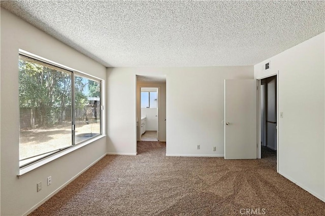457 Brian Ct, Merced, CA 95348 - unfurnished room with carpet floors and a textured ceiling
