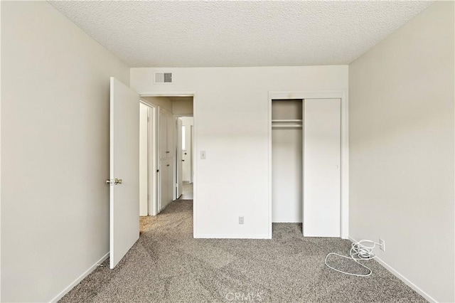 457 Brian Ct, Merced, CA 95348 - unfurnished bedroom with carpet flooring, a closet, and a textured ceiling