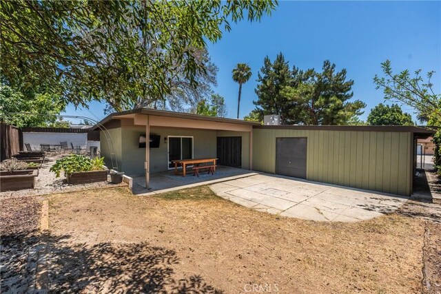 14137 Viburnum Dr, Whittier, CA 90604 - rear view of property with a patio area and a garden