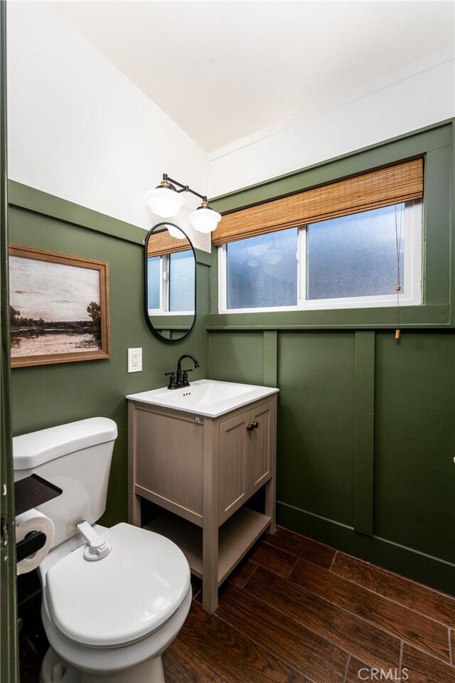 14137 Viburnum Dr, Whittier, CA 90604 - half bath featuring wood finished floors and vanity