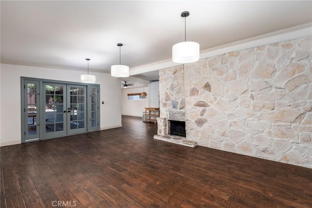 14137 Viburnum Dr, Whittier, CA 90604 - unfurnished living room featuring crown molding, wood finished floors, french doors, ceiling fan, and a stone fireplace