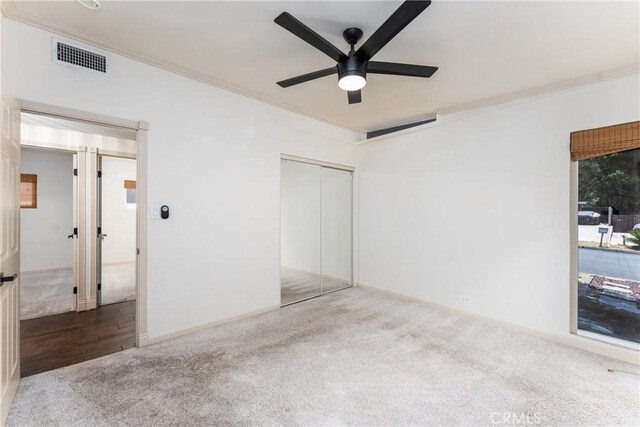 14137 Viburnum Dr, Whittier, CA 90604 - unfurnished bedroom with ornamental molding, carpet flooring, a closet, and a ceiling fan