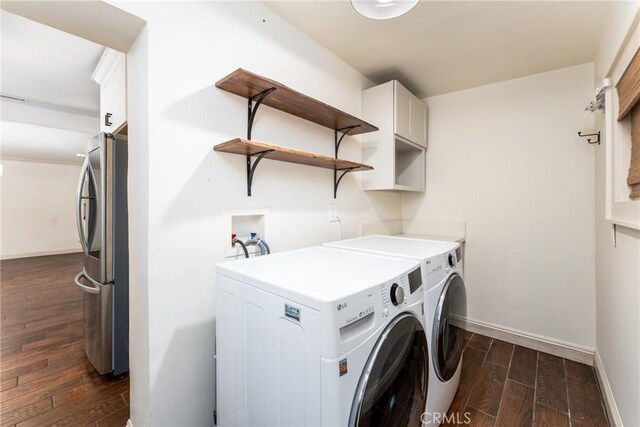 14137 Viburnum Dr, Whittier, CA 90604 - washroom with cabinet space, independent washer and dryer, and dark wood finished floors