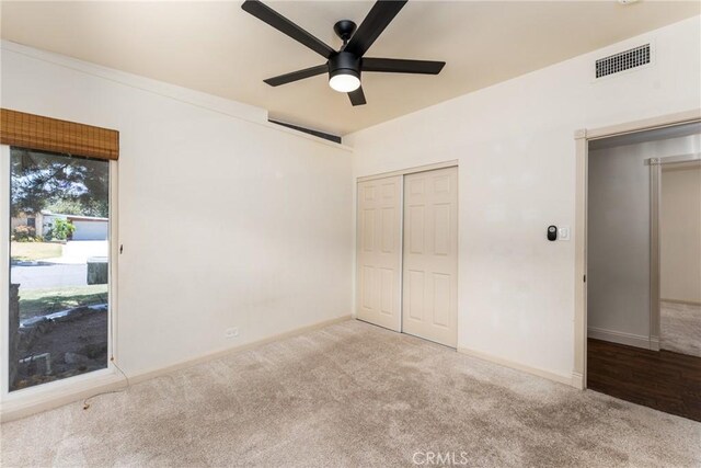 14137 Viburnum Dr, Whittier, CA 90604 - unfurnished bedroom featuring carpet floors, a closet, and a ceiling fan