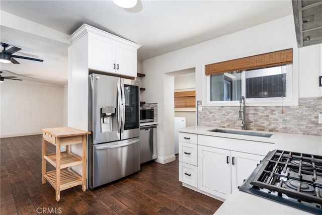 14137 Viburnum Dr, Whittier, CA 90604 - kitchen featuring appliances with stainless steel finishes, ceiling fan, light countertops, and dark wood-style floors