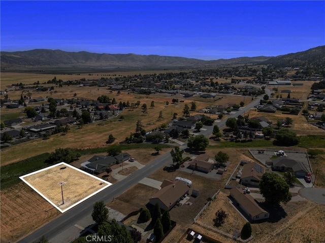 28201 Stallion Springs Dr, Tehachapi, CA 93561 - aerial overview of property's location featuring property parcel outlined and nearby suburban area