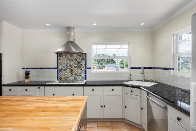 28201 Stallion Springs Dr, Tehachapi, CA 93561 - kitchen featuring wall chimney range hood, stainless steel dishwasher, white gas stovetop, plenty of natural light, and ornamental molding