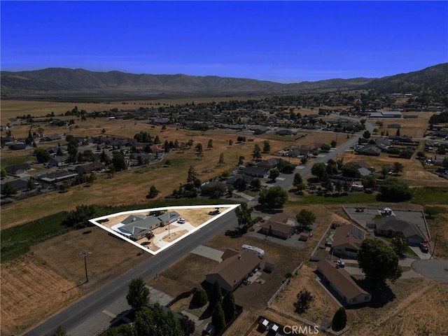 28201 Stallion Springs Dr, Tehachapi, CA 93561 - aerial overview of property's location with property boundaries highlighted and a mountain backdrop