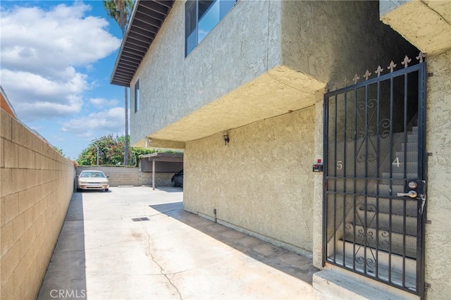 1524 Acacia Unit 5, Alhambra, CA 91801 - view of side of home featuring stucco siding and a patio area
