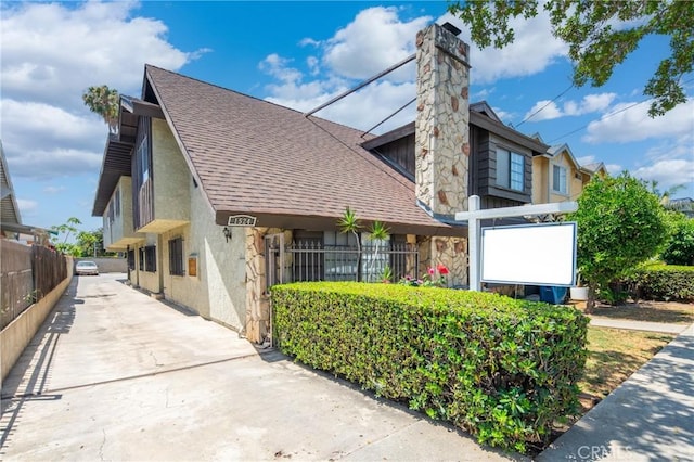 1524 Acacia Unit 5, Alhambra, CA 91801 - view of front of home with roof with shingles, a chimney, and stucco siding