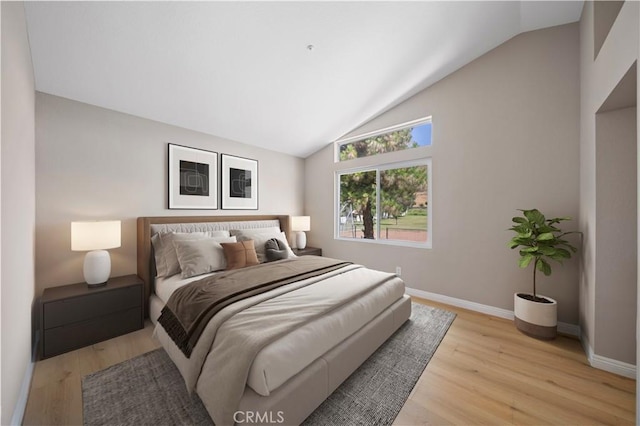 15965 Peach Tree Ln, Fontana, CA 92337 - bedroom featuring lofted ceiling and light wood finished floors
