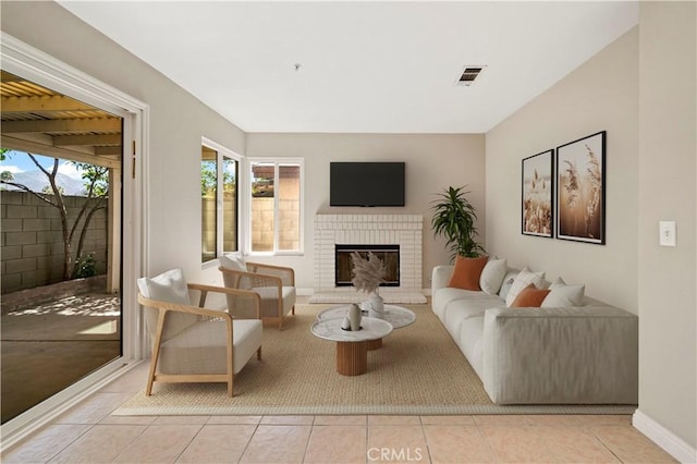 15965 Peach Tree Ln, Fontana, CA 92337 - living area featuring tile patterned floors and a fireplace